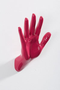 Hand wall art or hook, waving gesture, and pink colour