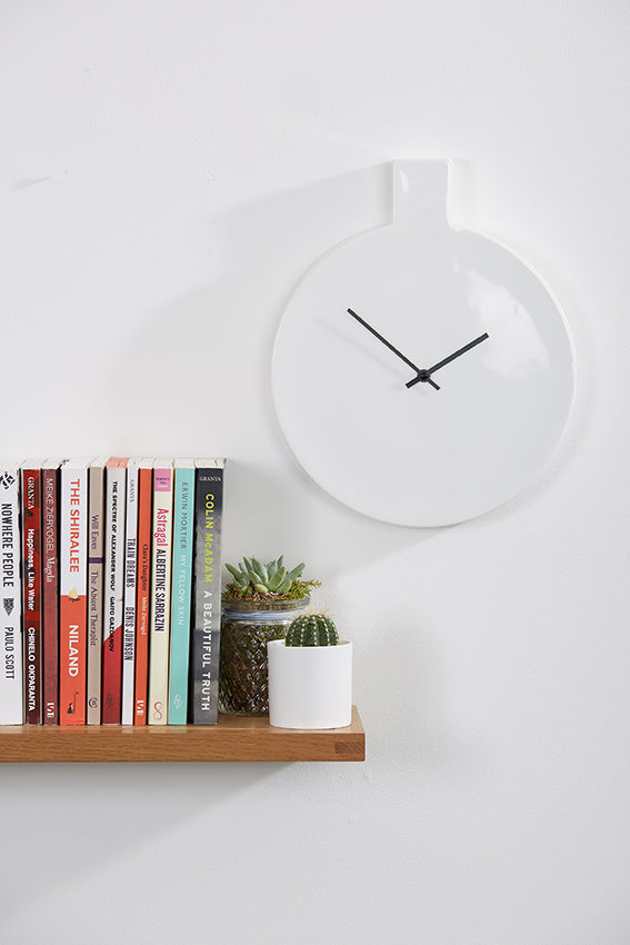 Ceramic wall clock, round, white colour, books on bookshelf