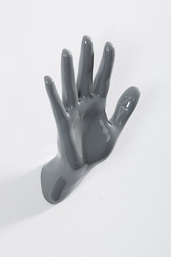 Hand wall art or hook, waving gesture, and grey colour
