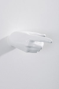 Hand wall art or hook, pointing gesture, and white colour