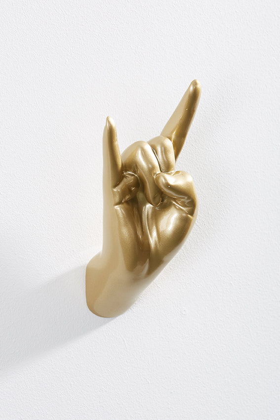 Hand wall art or hook, rock on gesture, and gold colour