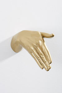 Hand wall art or hook, shaking gesture, and gold colour