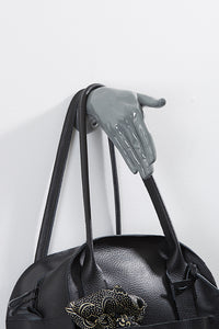 Hand wall art or hook, shaking gesture, grey colour, and hanging bag