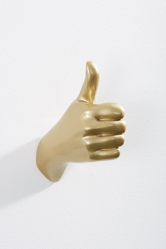 Hand wall art or hook, shape of thumbs up gesture, and gold colour