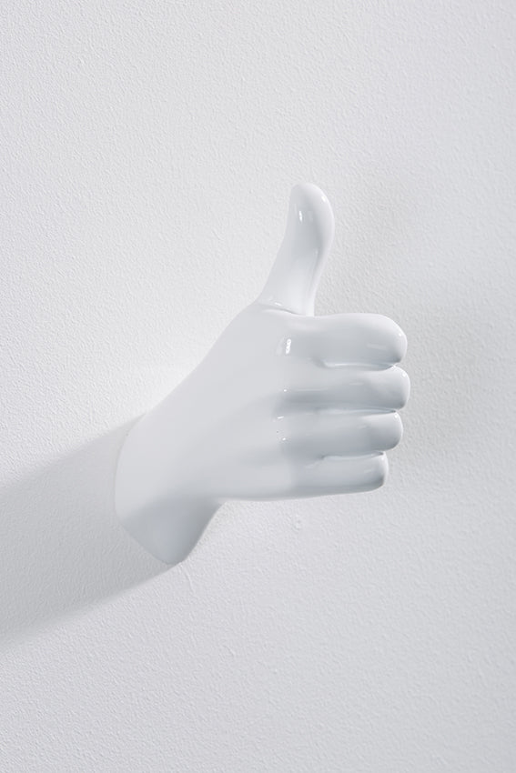 Hand wall art or hook, shape of thumbs up gesture, and white colour