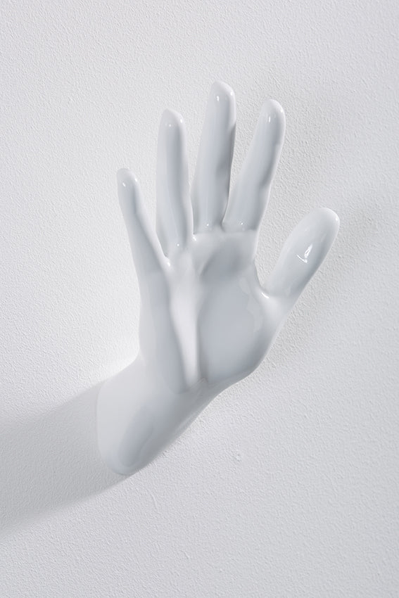 Hand wall art or hook, waving gesture, and white colour
