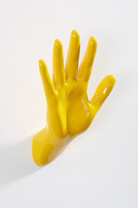 Hand wall art or hook, waving gesture, and yellow colour