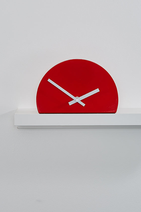 Metal shelf clock, red, half shape, and white hands